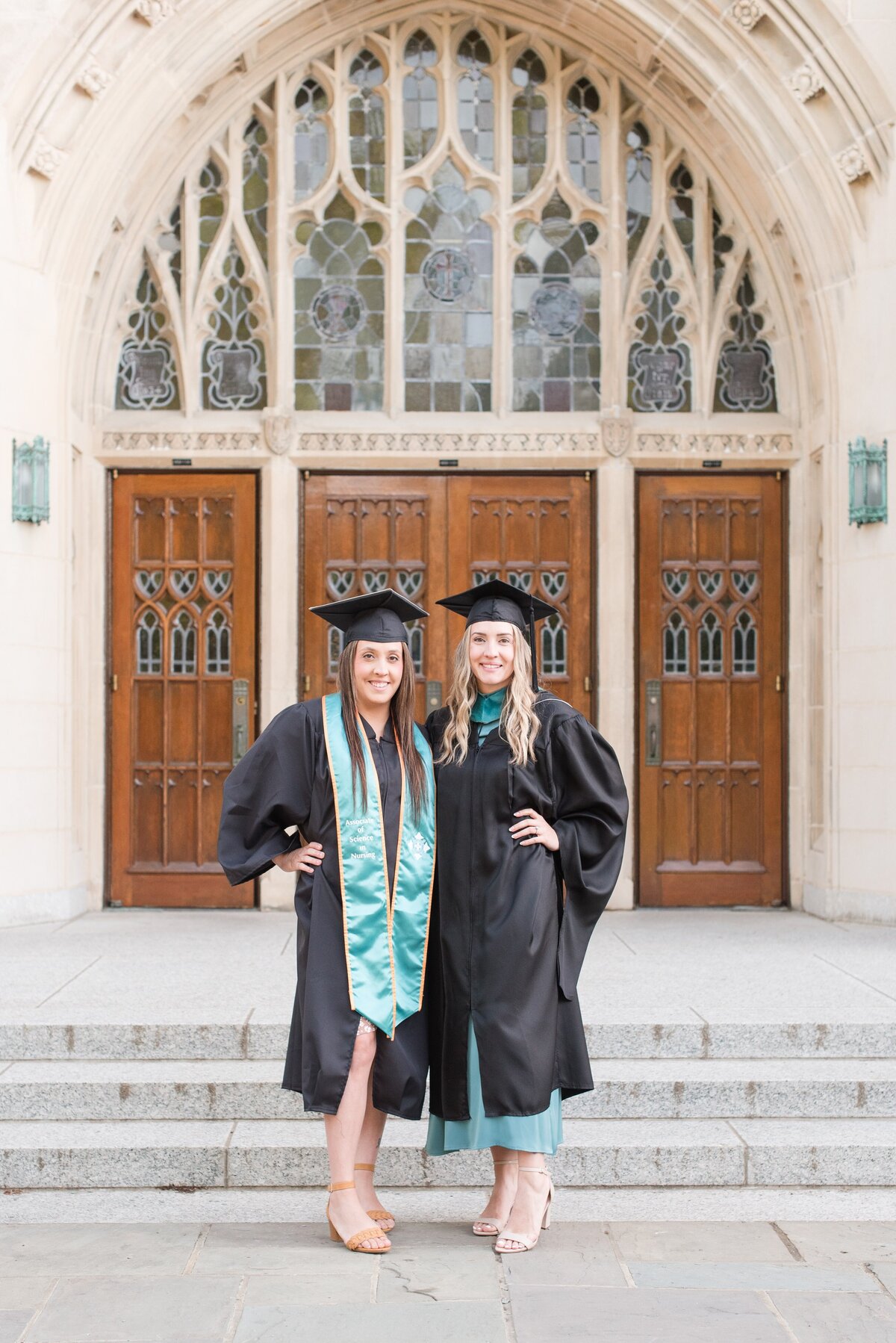 twin sisters in regalia graduation