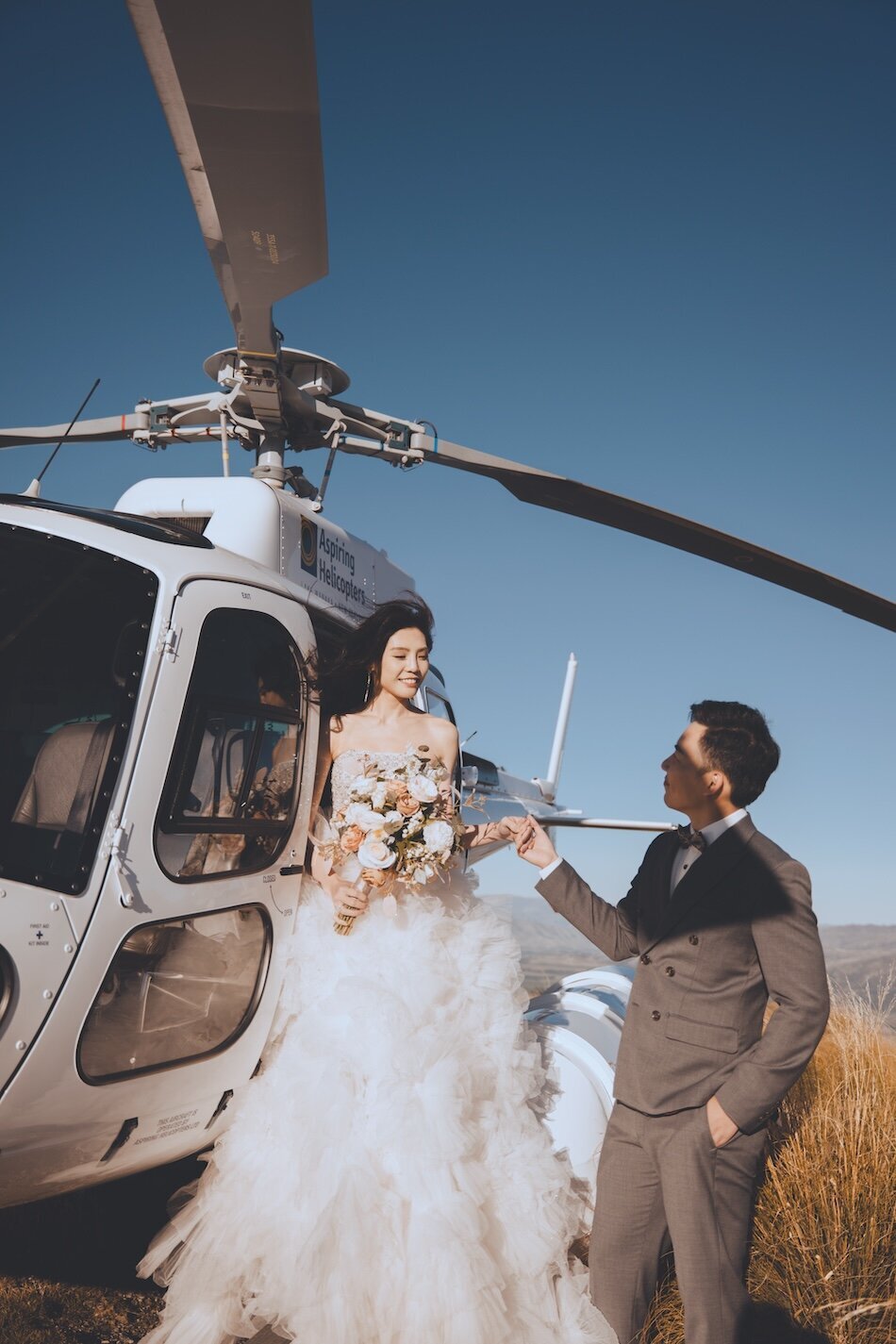 Autumn wedding shoot at Millbrook, Arrowtown. Vintage car & helicopter.