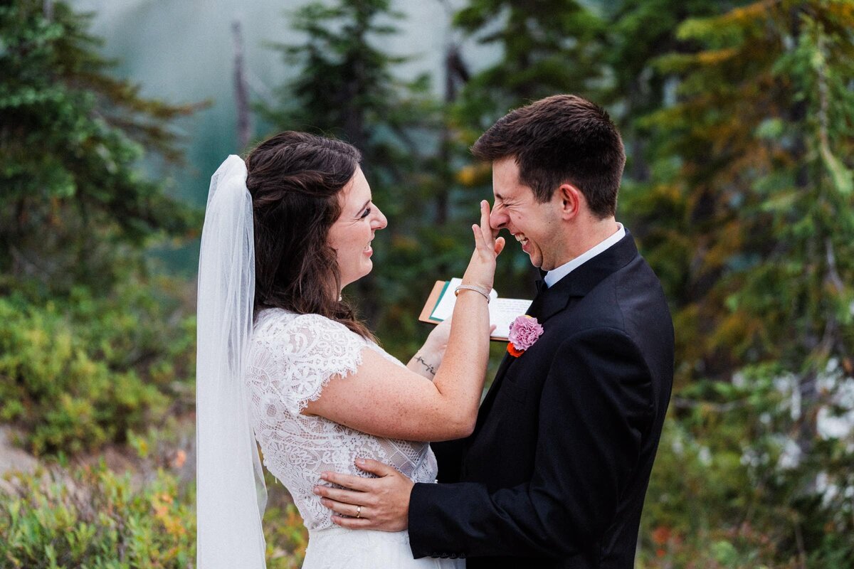 bride wiping away tears after vow reading photographed by Alexandria, a Washington Elopement Photographer