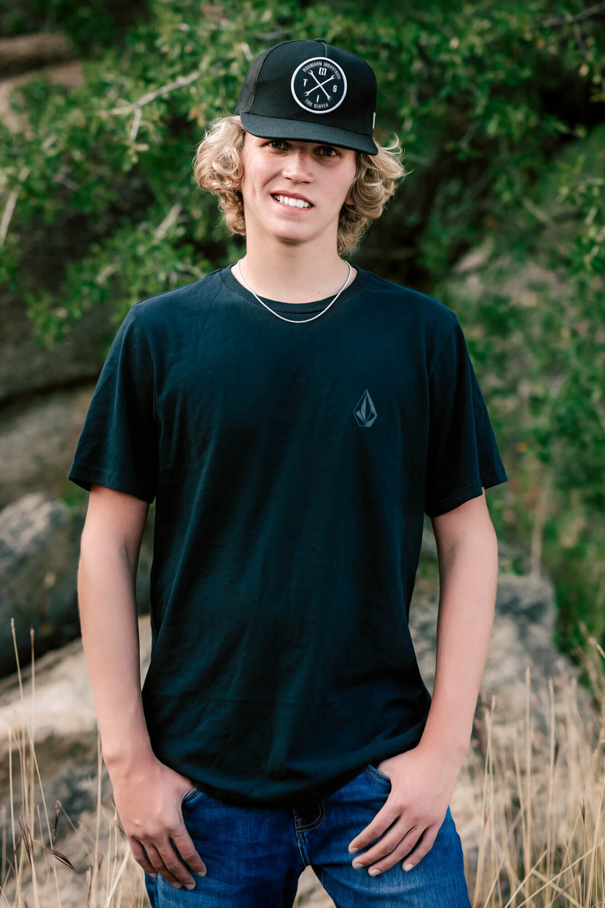 Boy poses in Granite Dells for Prescott senior photos