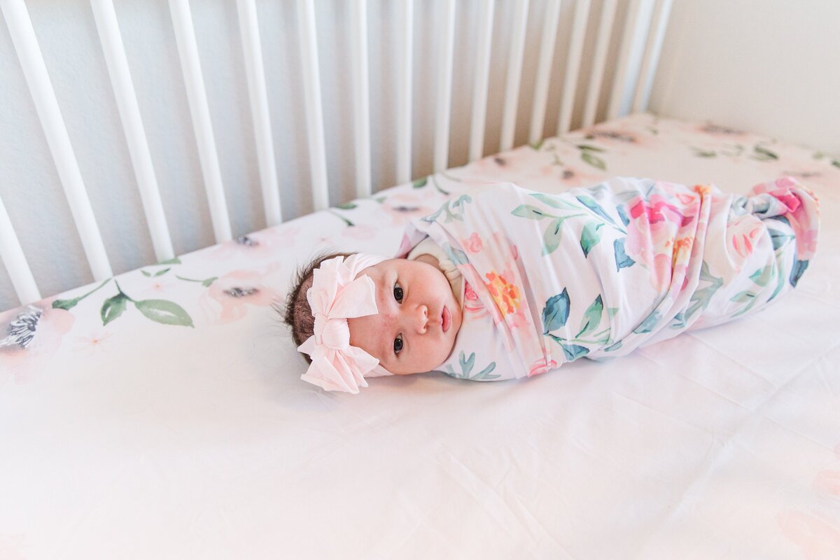 Newborn girl in her bed in Erie, Colorado