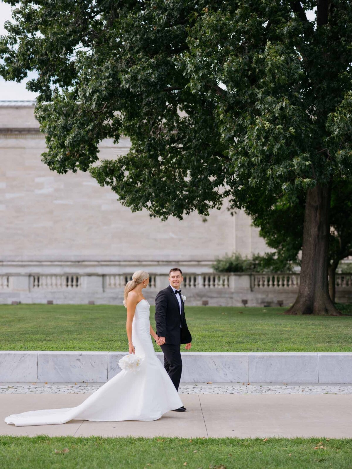 Bride and groom walking at Cleveland Art Museum