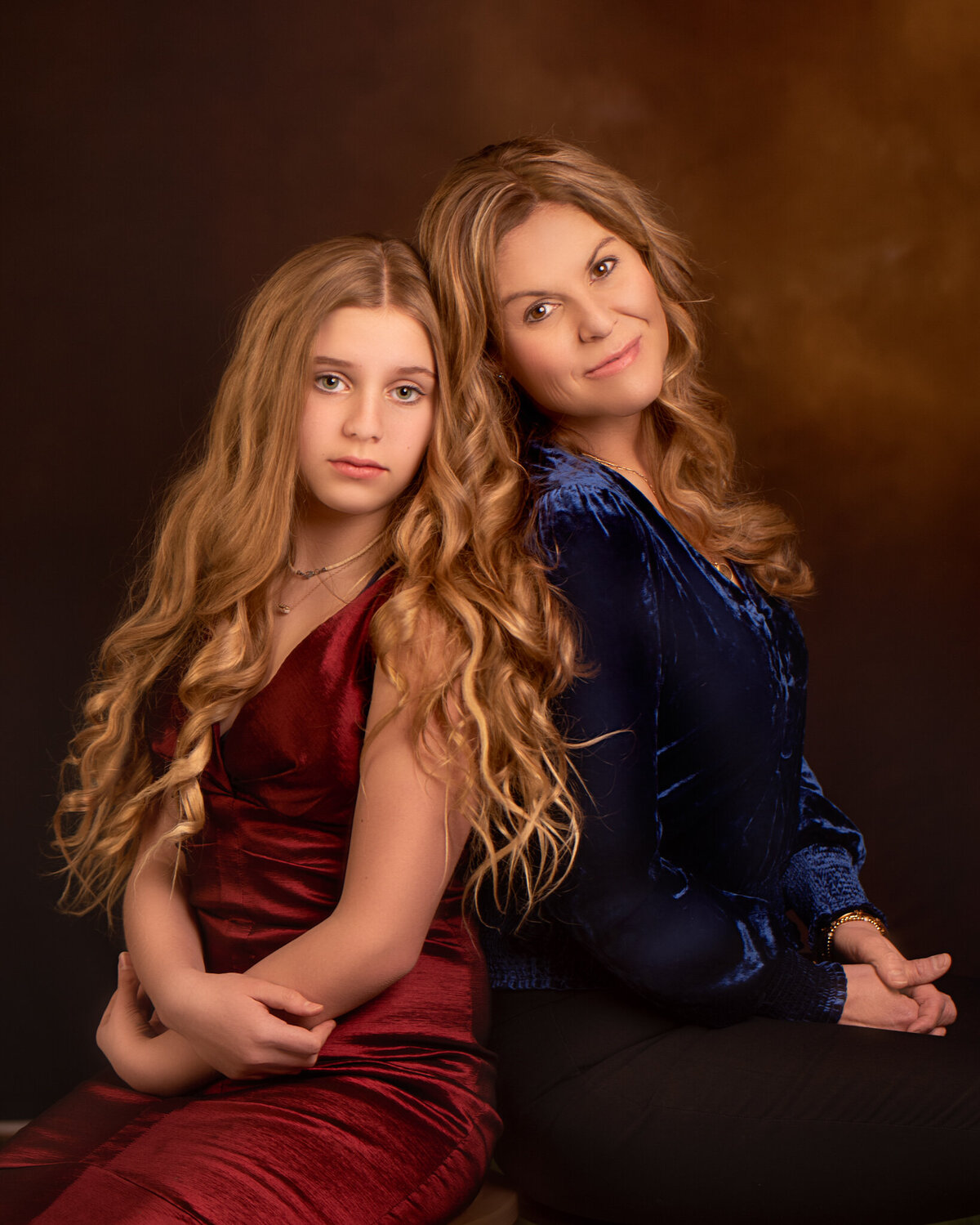 Sophisticated studio portrait of a mother and daughter dressed in pink outfits, captured in Overland Park, Kansas. A timeless option for families looking for refined and elegant family photography in the Kansas City metro area.