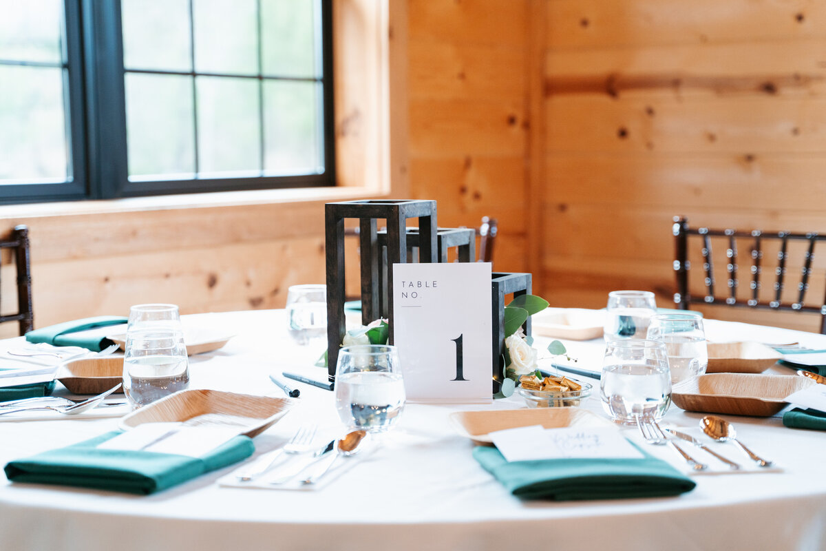 Rustic wedding details with greenery and neutral tones