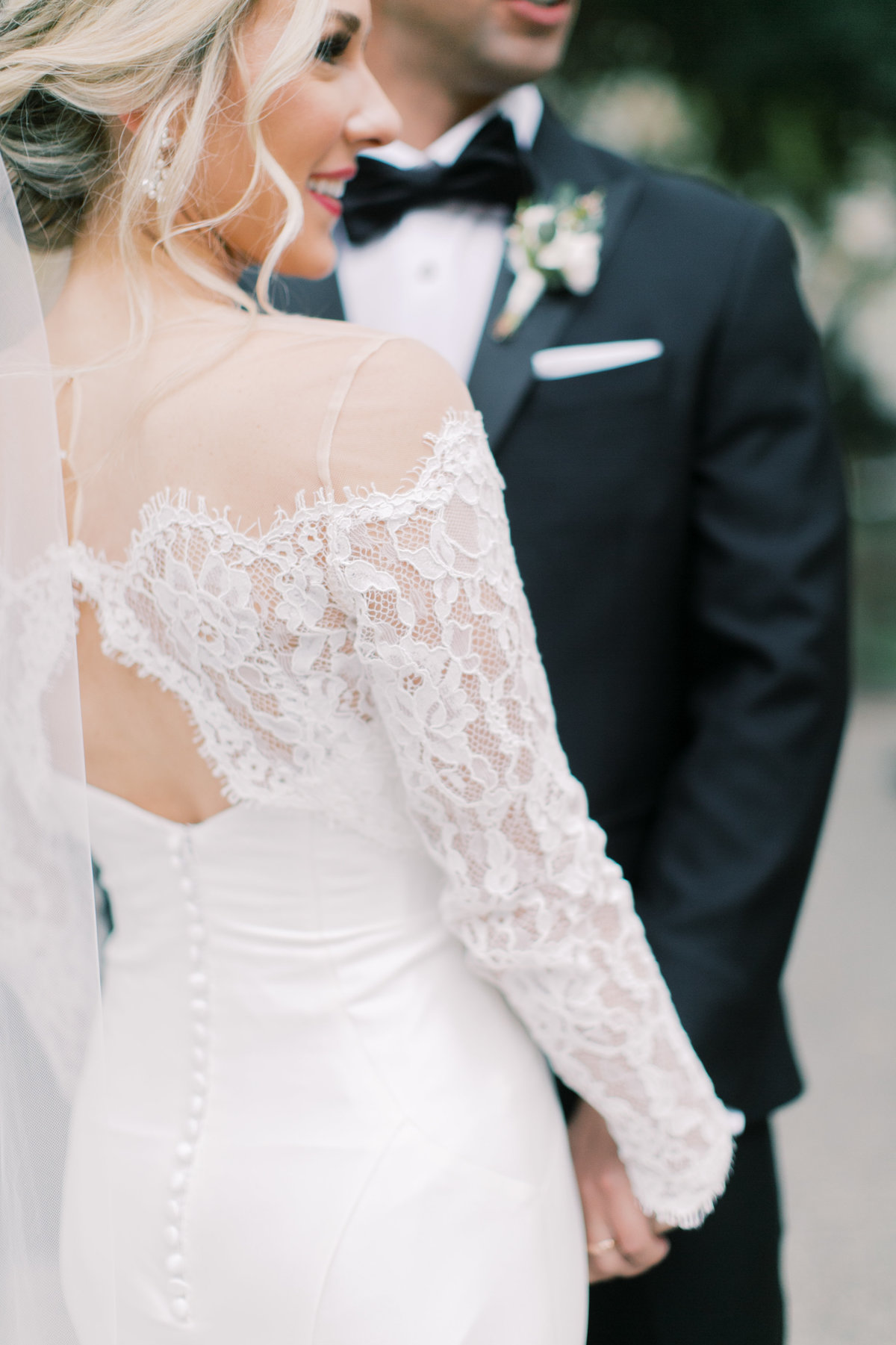 bride and groom holding hands on wedding day