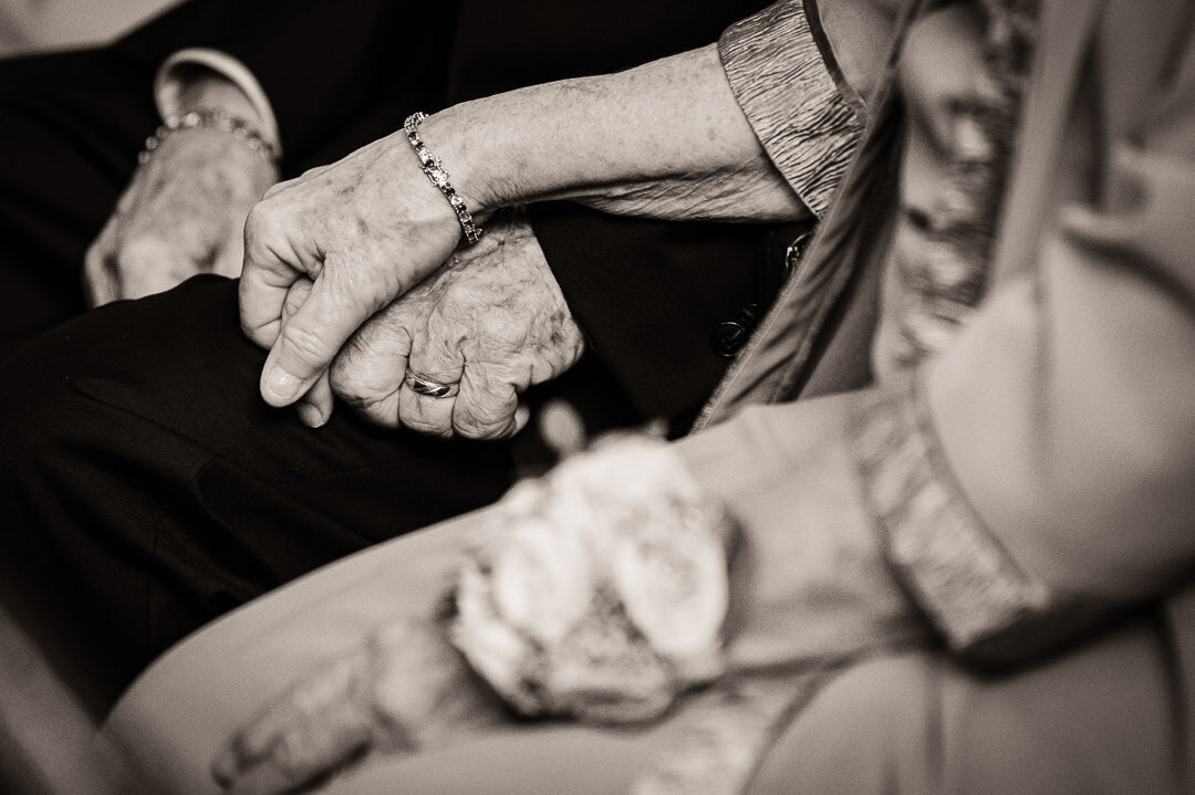 grandparents-holding-hands-wedding-photo-emotional-moment-by-alex-kaplan