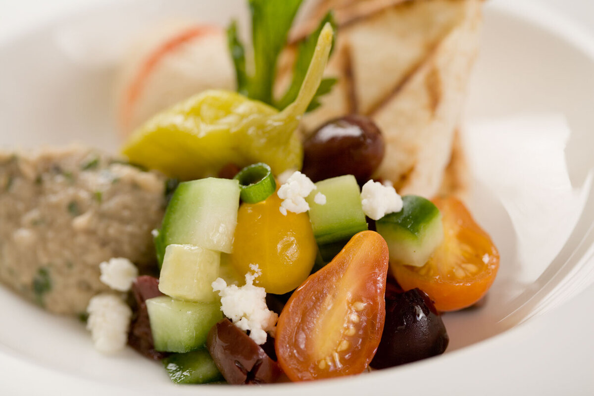 Close-up of Mediterranean salad with olives and tomatoes