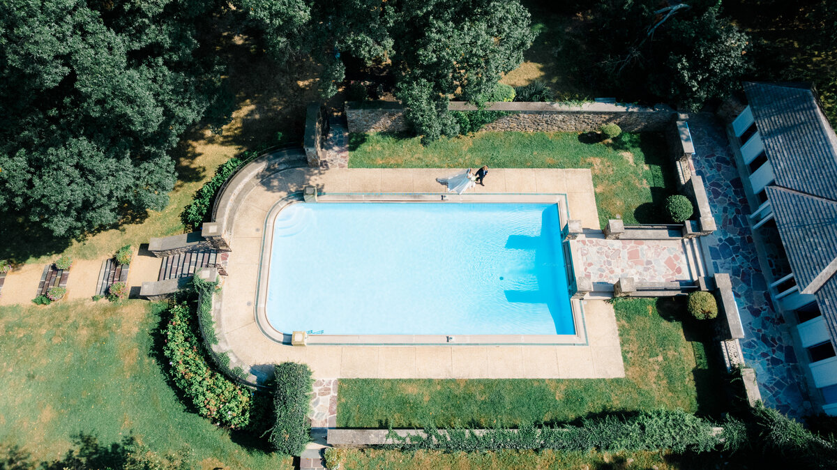 lauxmont farms wedding, bride and groom walking around pool shot on drone, wedding photography, lancaster wedding photographer
