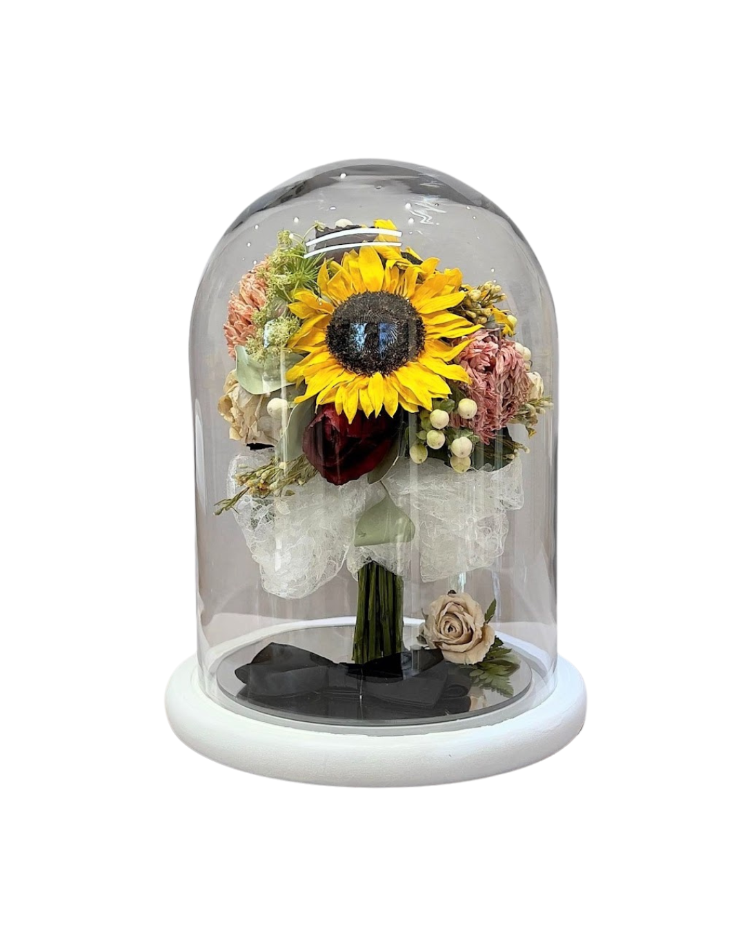 wedding bouquet preserved inside a dome.
