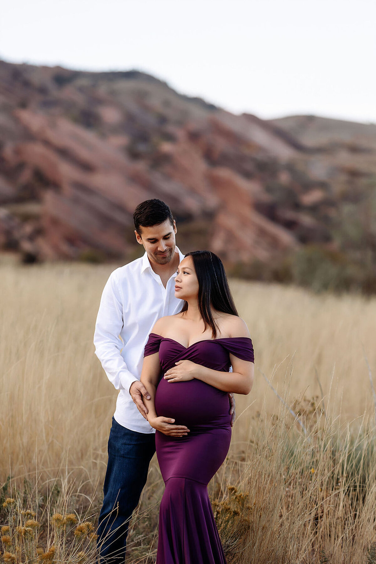 red rocks maternity session with mama in a berry gown