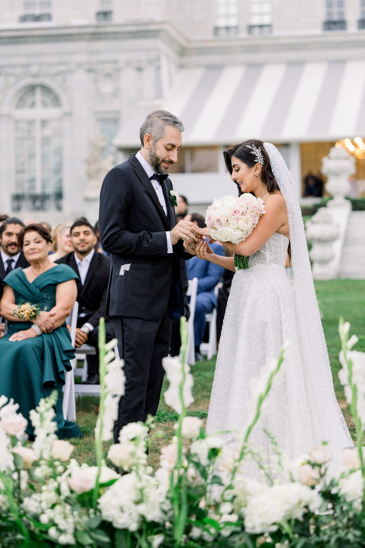 searing exchange during at wedding ceremony at rosecliff mansion in newport rhode island 
