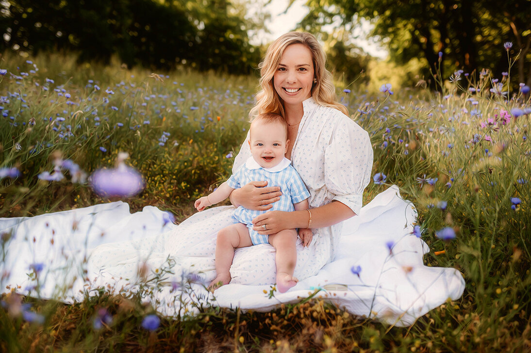 Mother poses with her son in a field of flowers during Family Photoshoot in Asheville.