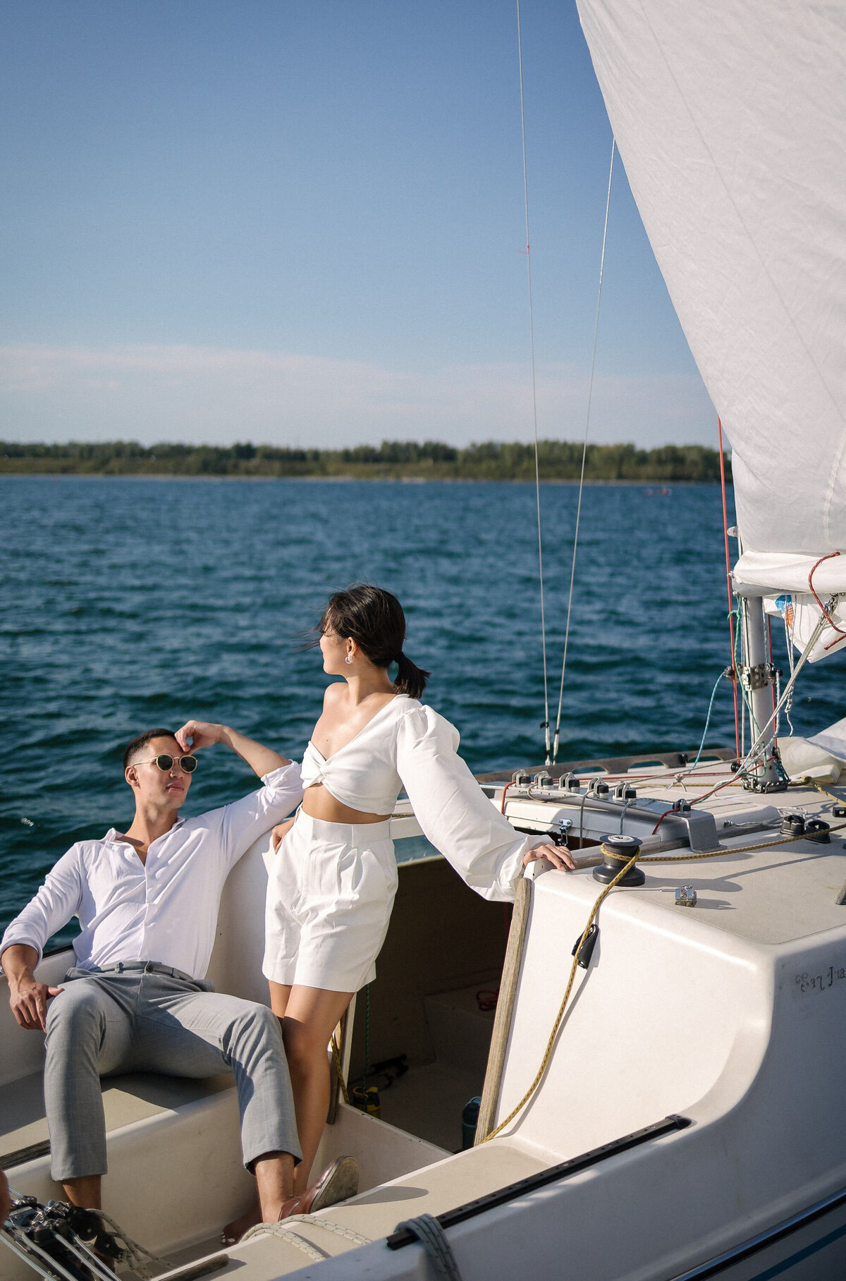Stunning engagement session inspiration, couple on sailboat, OR Imagery, authentic and intimate wedding photographer in Calgary, Alberta. Featured on the Bronte Bride Vendor Guide.