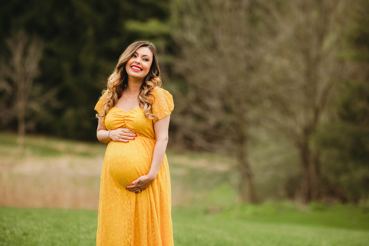 london ontario maternity photos smiling mom in yellow maternity dress