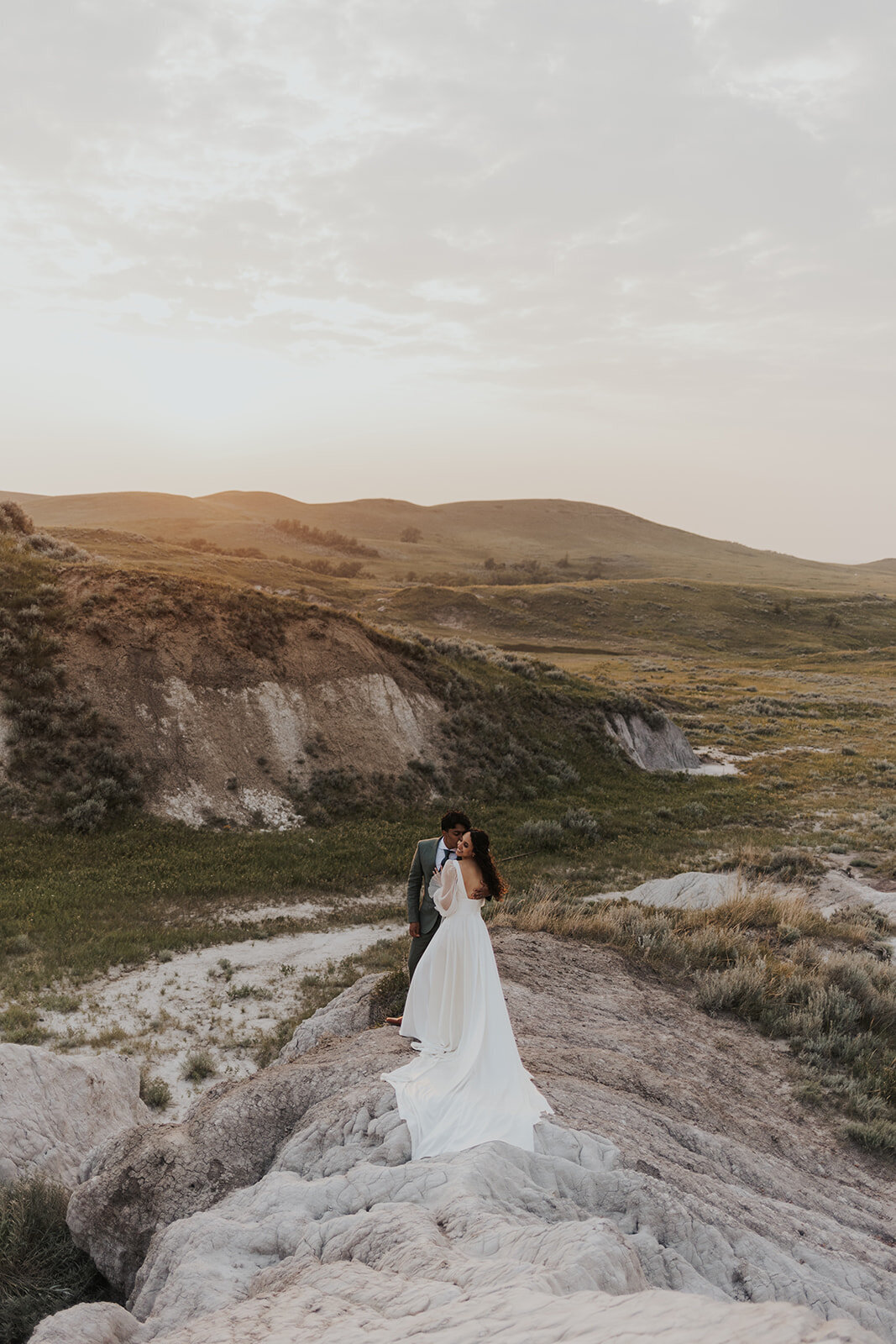 A couple enjoys the beauty of nature on their wedding day in Saskatchewan