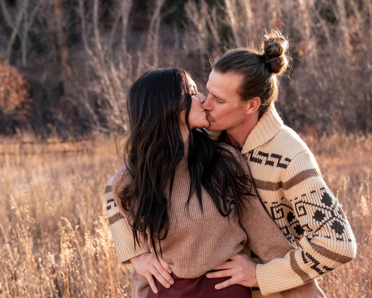 denver colorado wedding photographer - couple kissing in field
