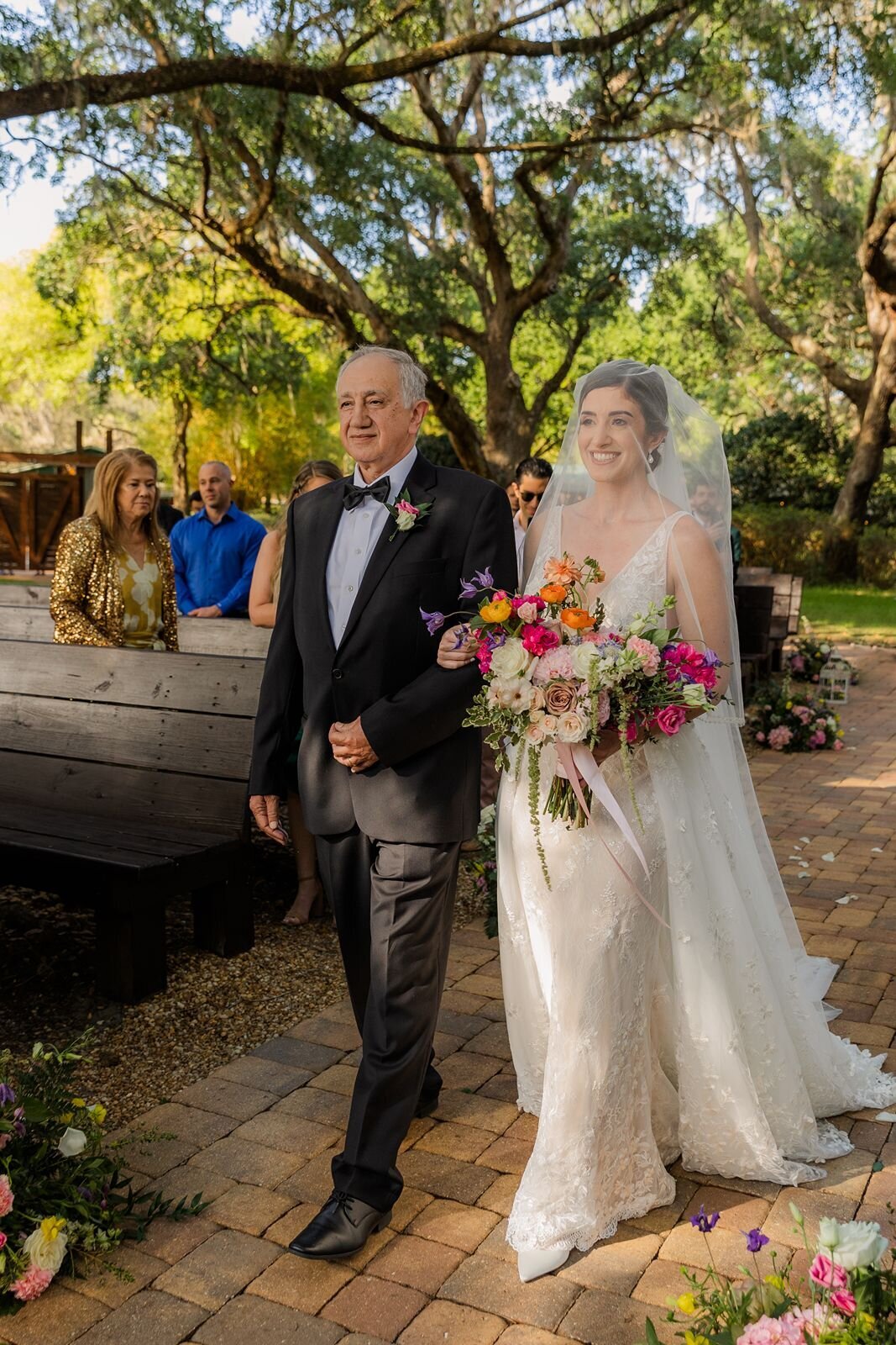 Father walking daughter down the  aisle at wedding ceremony at Club Lake Plantation Apopka Florida