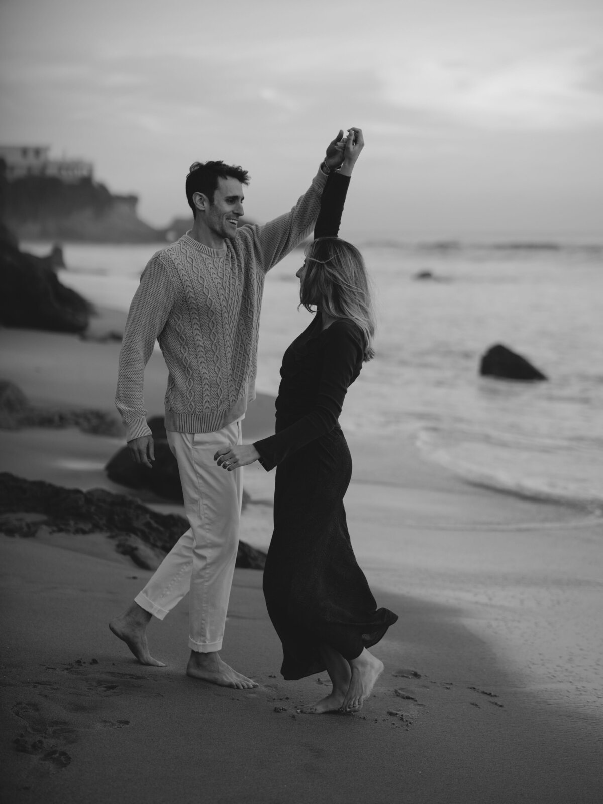 Couple dancing together on the beach