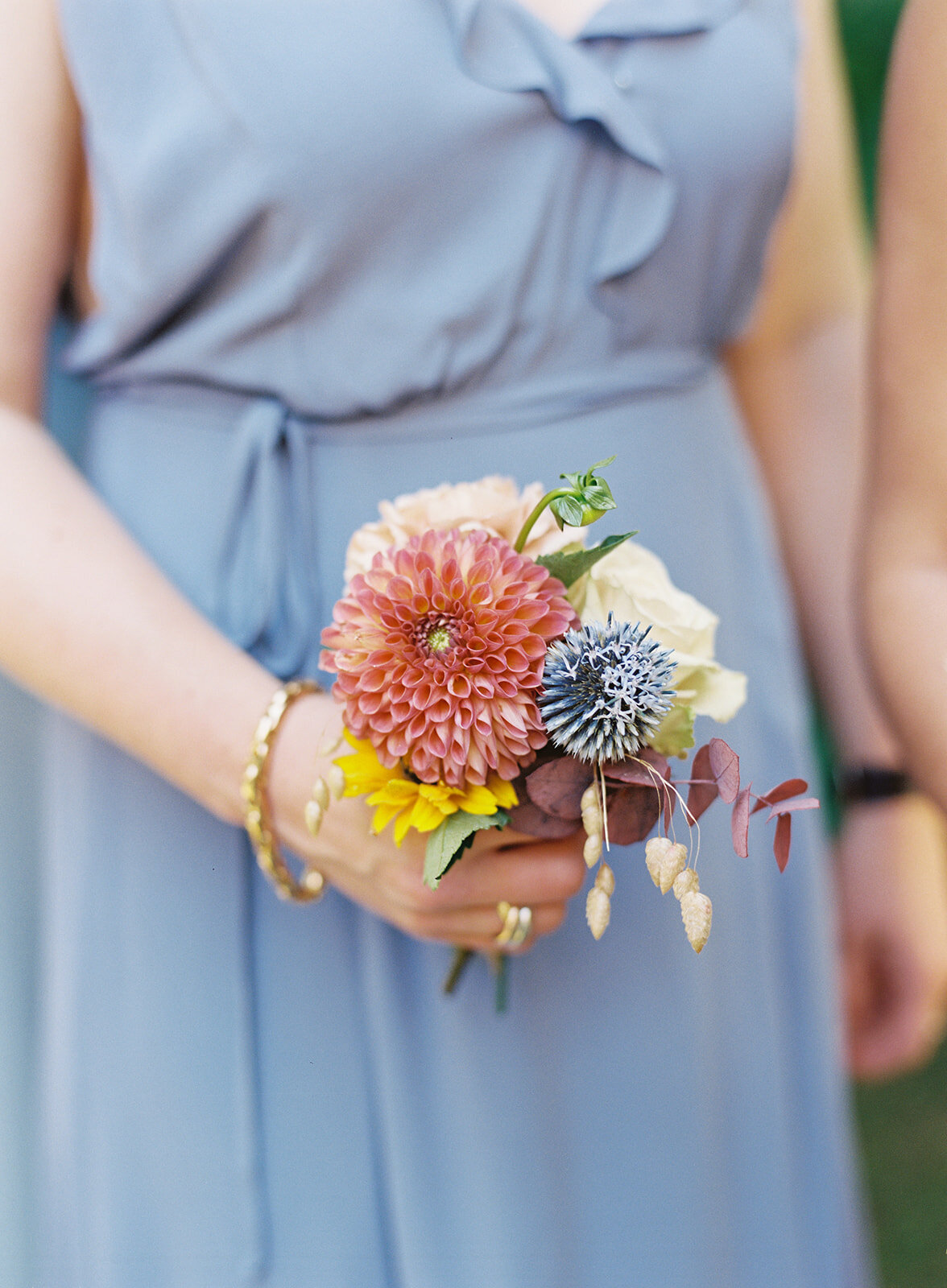 Bridesmaid dress in variety of pastel colors with brighter wildflower bouquets for an early fall wedding at RT Lodge. Flowers by Rosemary & Finch floral design, based in Nashville, TN.