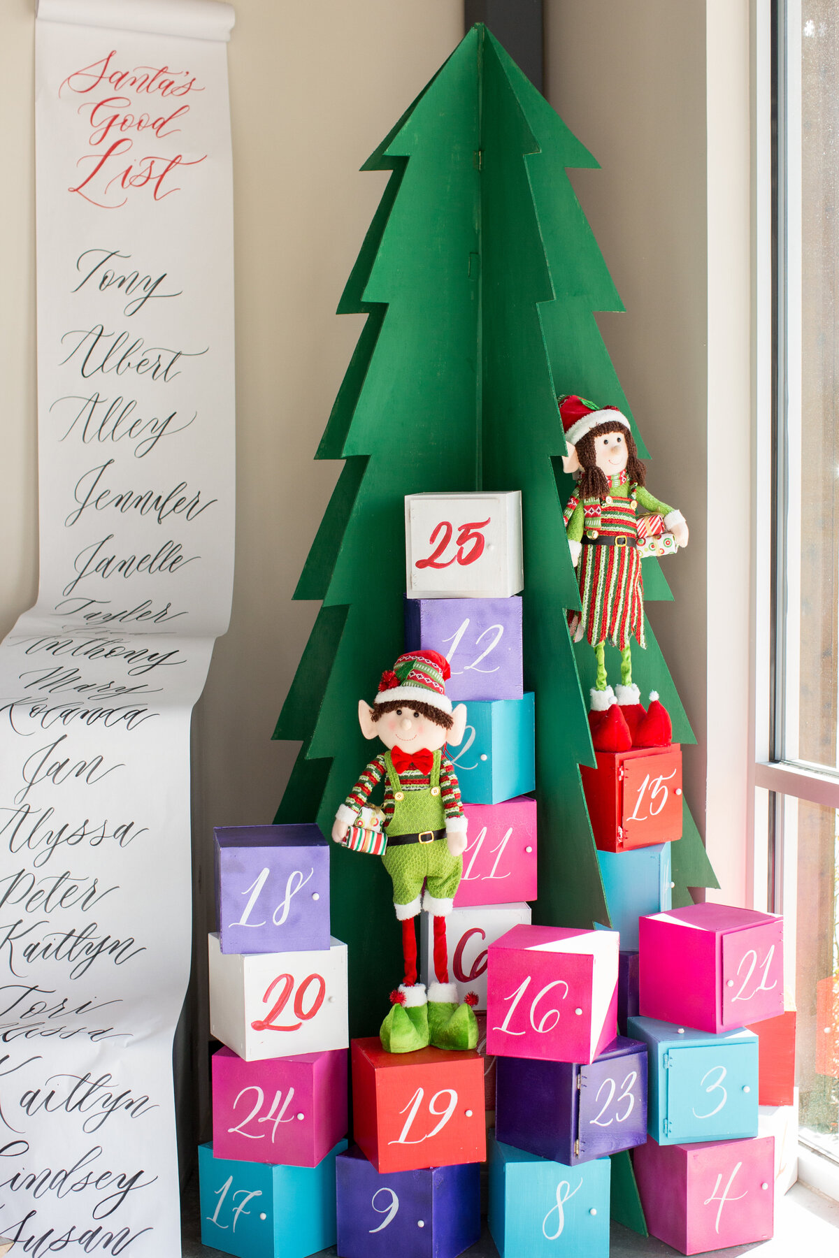 Festive 25 Days of Christmas themed display with Santa's list and colorful boxes