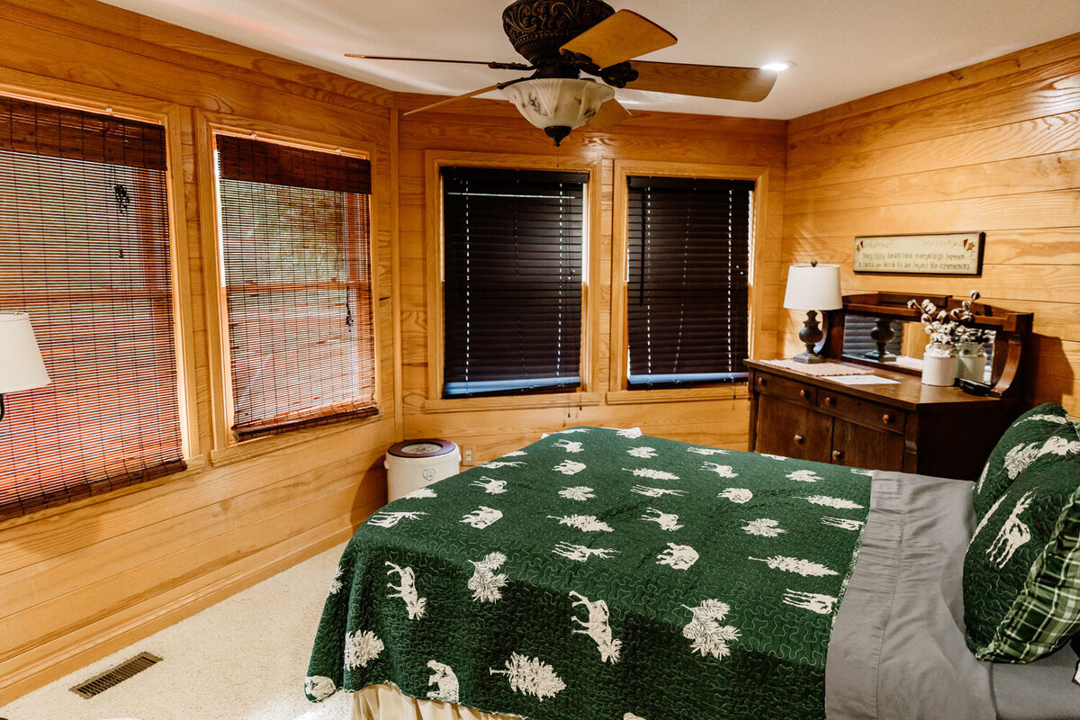 Warm and inviting bedroom with wood-paneled walls