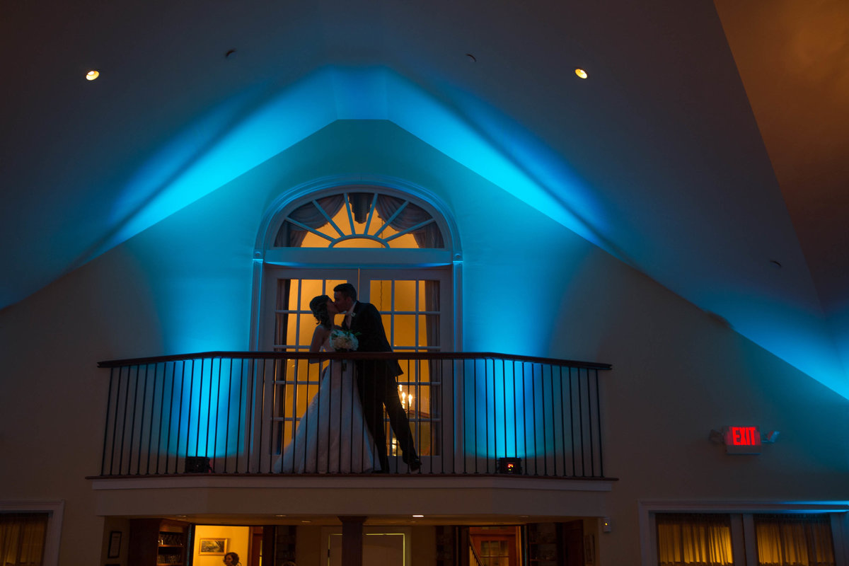 bride and groom on balcony at The Riverhouse