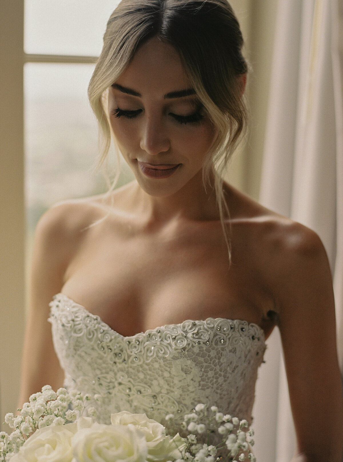 A portrait of the bride getting ready for her destination wedding in Quinta da Bellavista in Sintra, Portugal