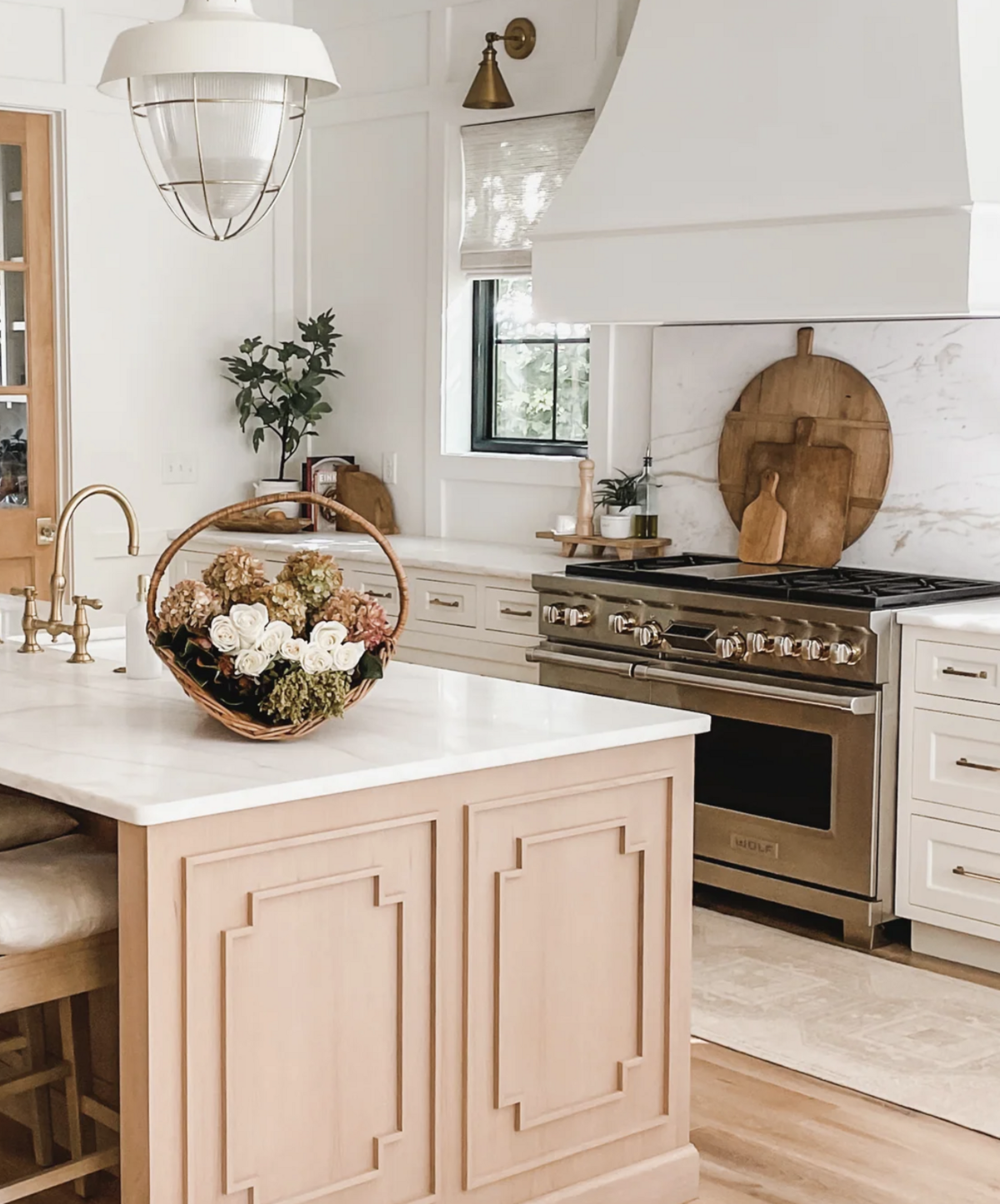 The custom cabinets feature millwork that echoes the woodwork in the rest of the home