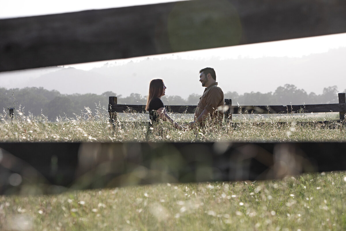 engagement shoot with fence in field