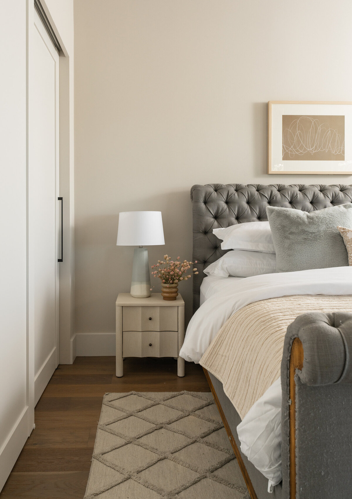 kids bedroom king size bed natural wood nightstand dark wood floors white bedding blue accent natural wood nightstand