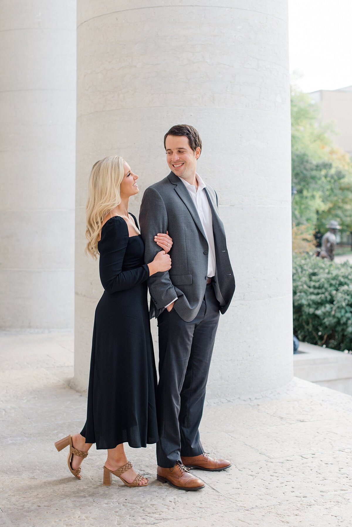 Bride looking at Groom during engagement session at Ohio State House taken by the best Ohio Wedding Photographer