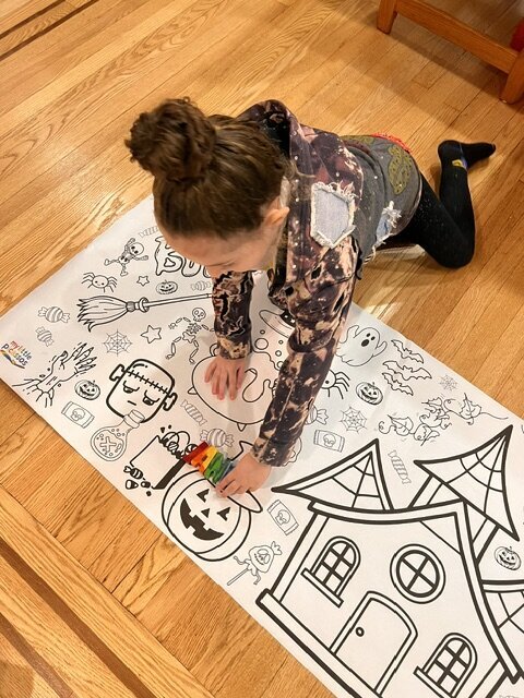 little girl coloring halloween banner