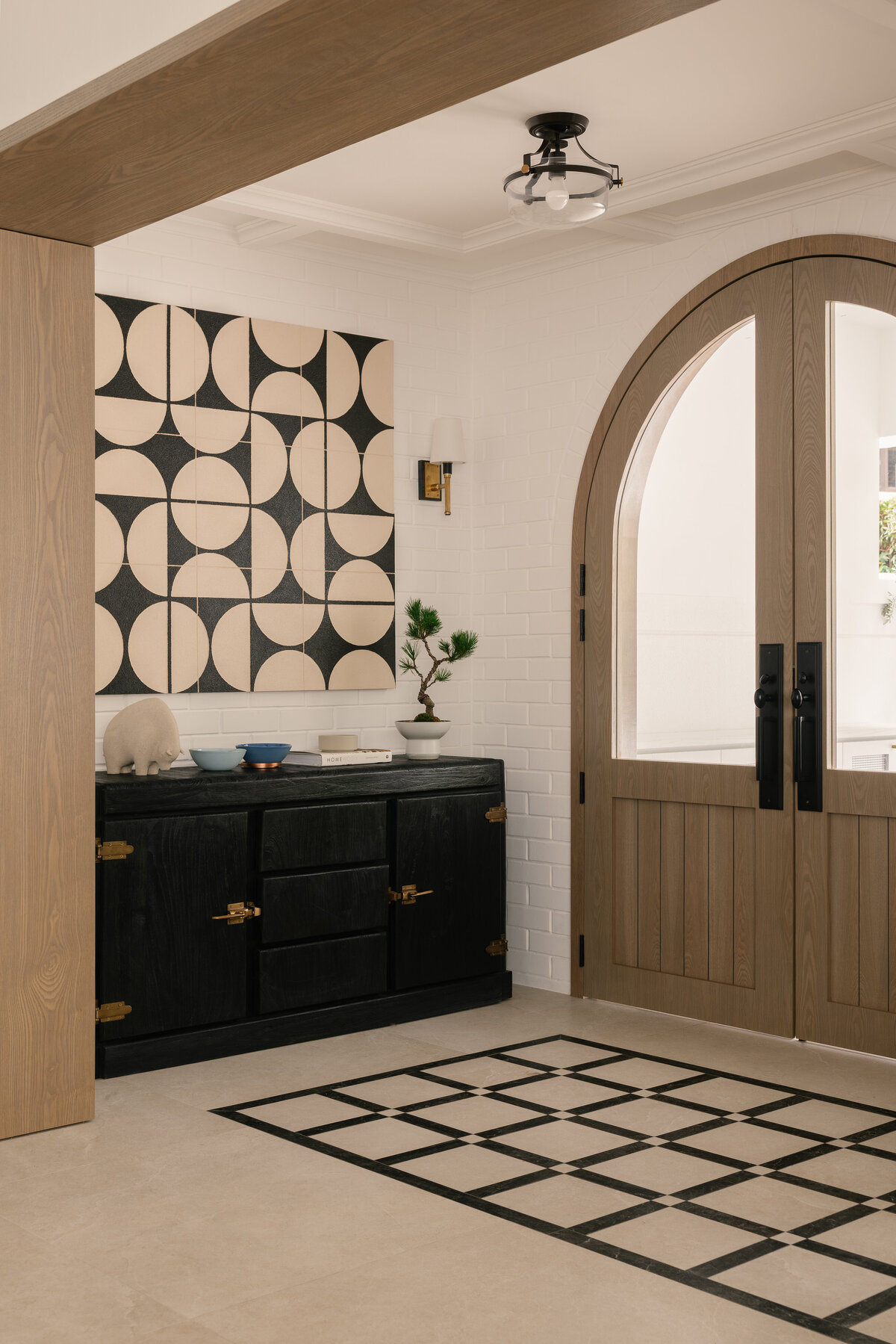 Entryway to a house with a door and console table