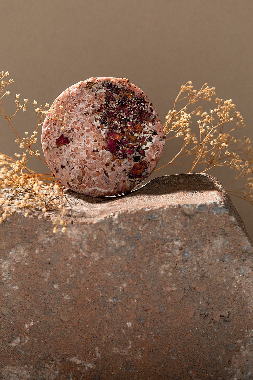 soap styled on a rock for product photography