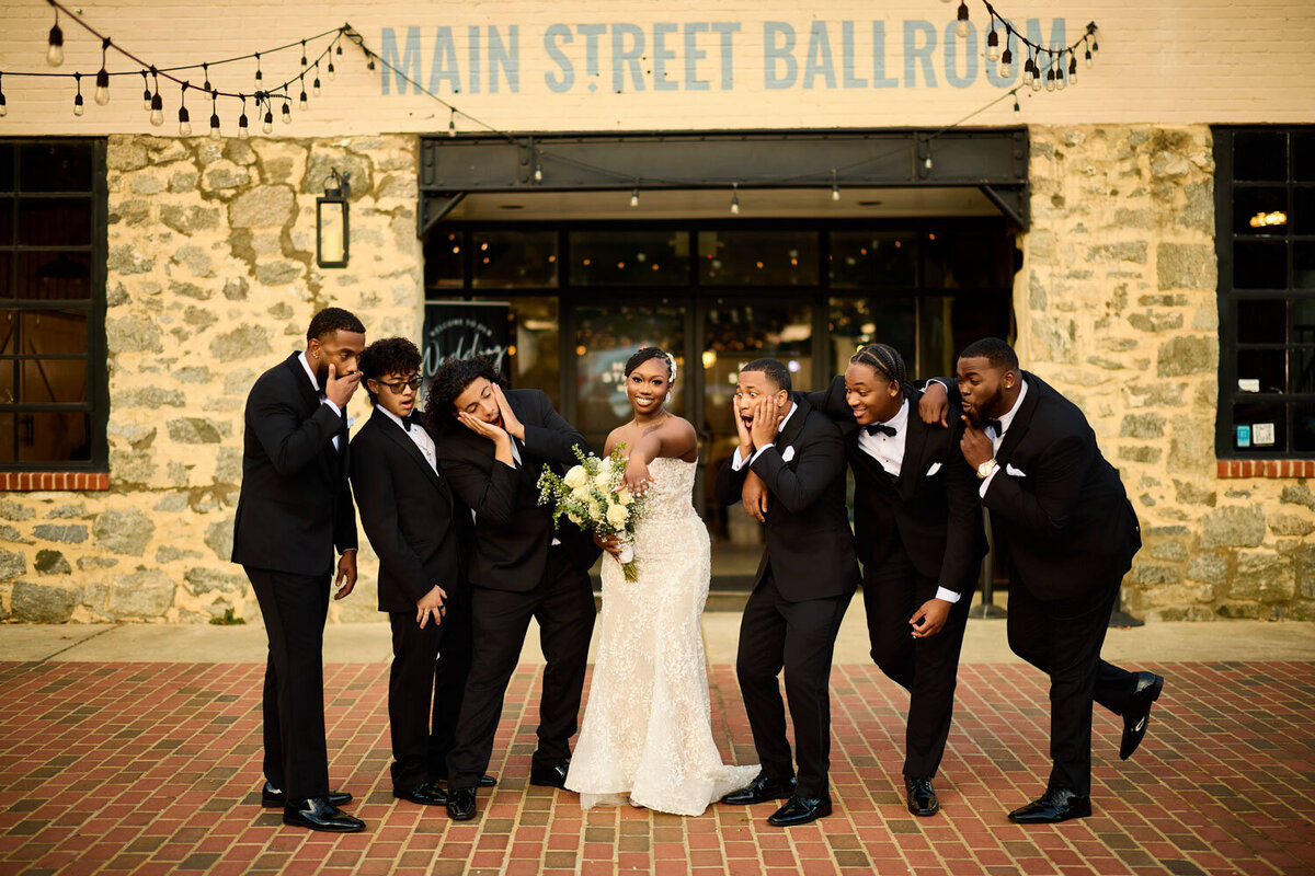 Bride with groomsmen beside her