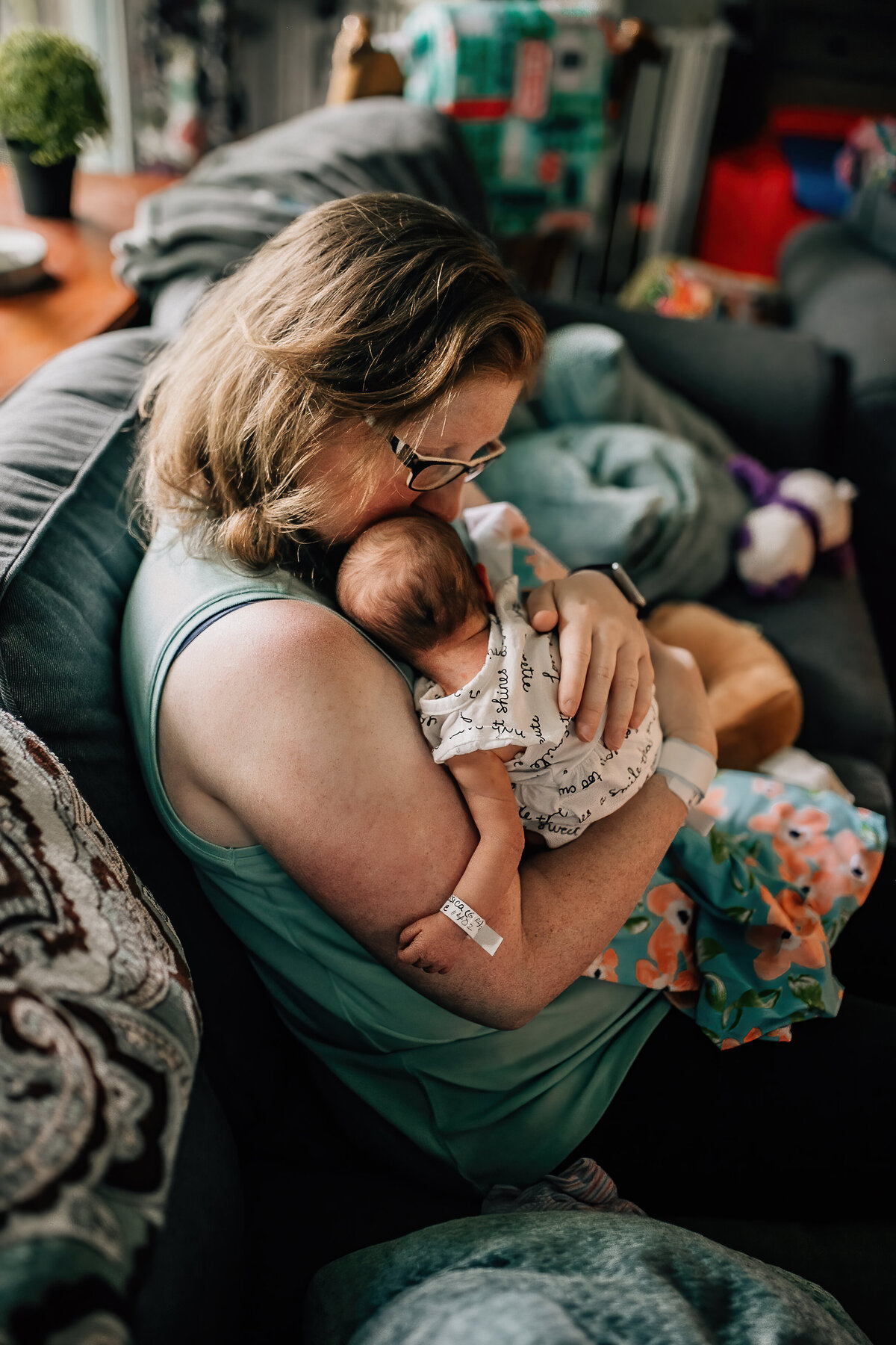 Infant photography of a mom holding new born baby