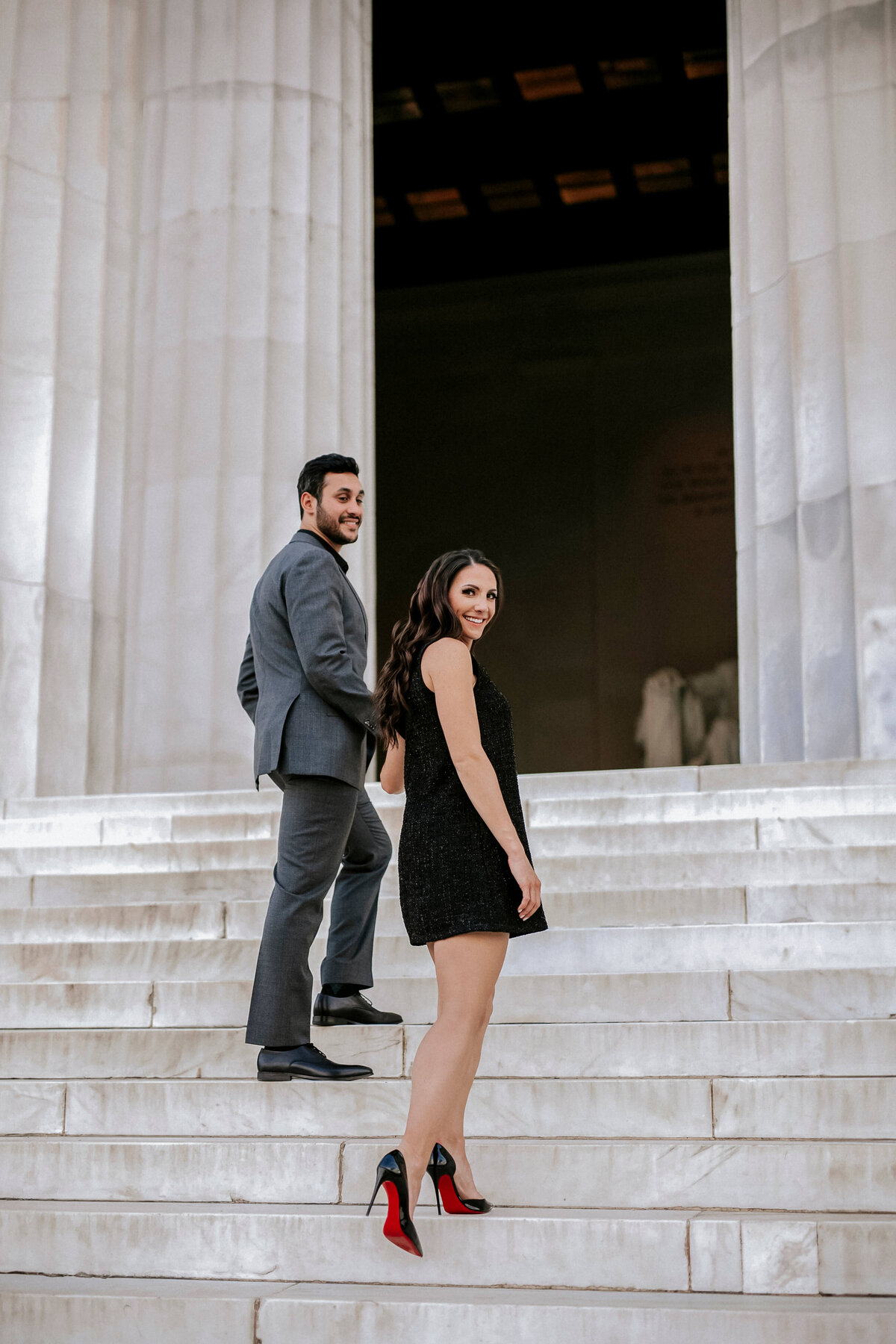 sophisticated-couple-wearing-chanel-and-louboutins-walking-up-steps-of-lincoln-memorial
