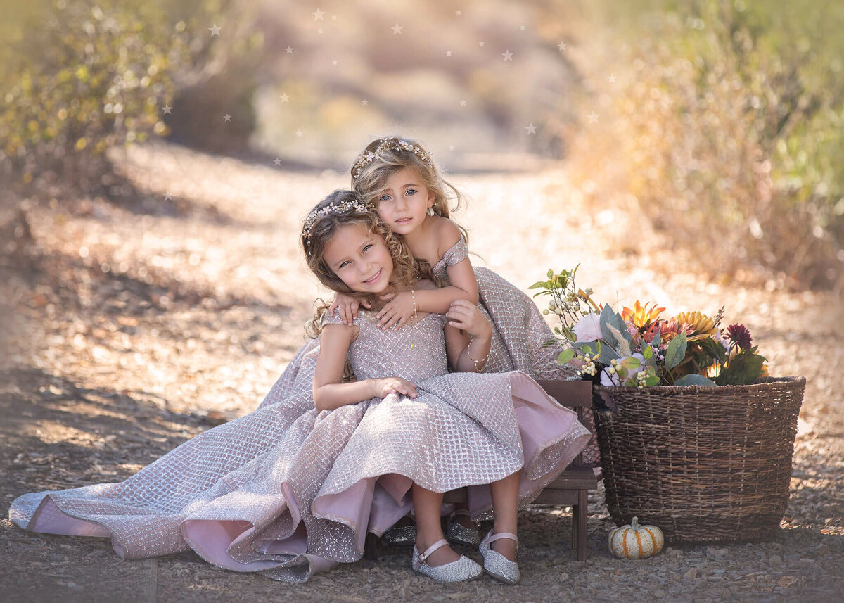 Sisters hugging in beautiful gowns in Woodland Hills