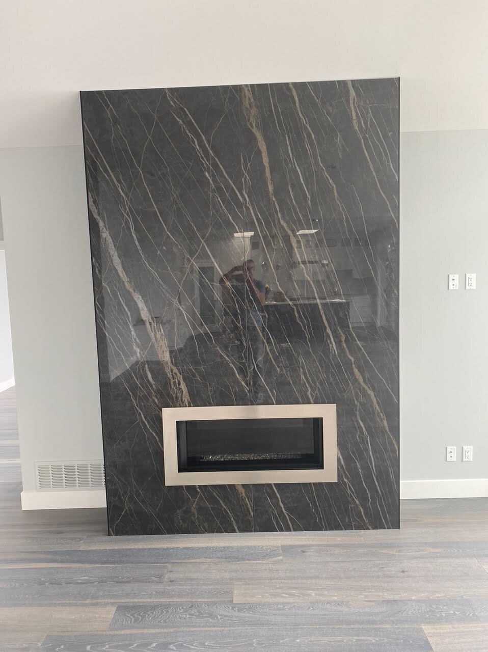 Natural stone fireplace design with modern insert.