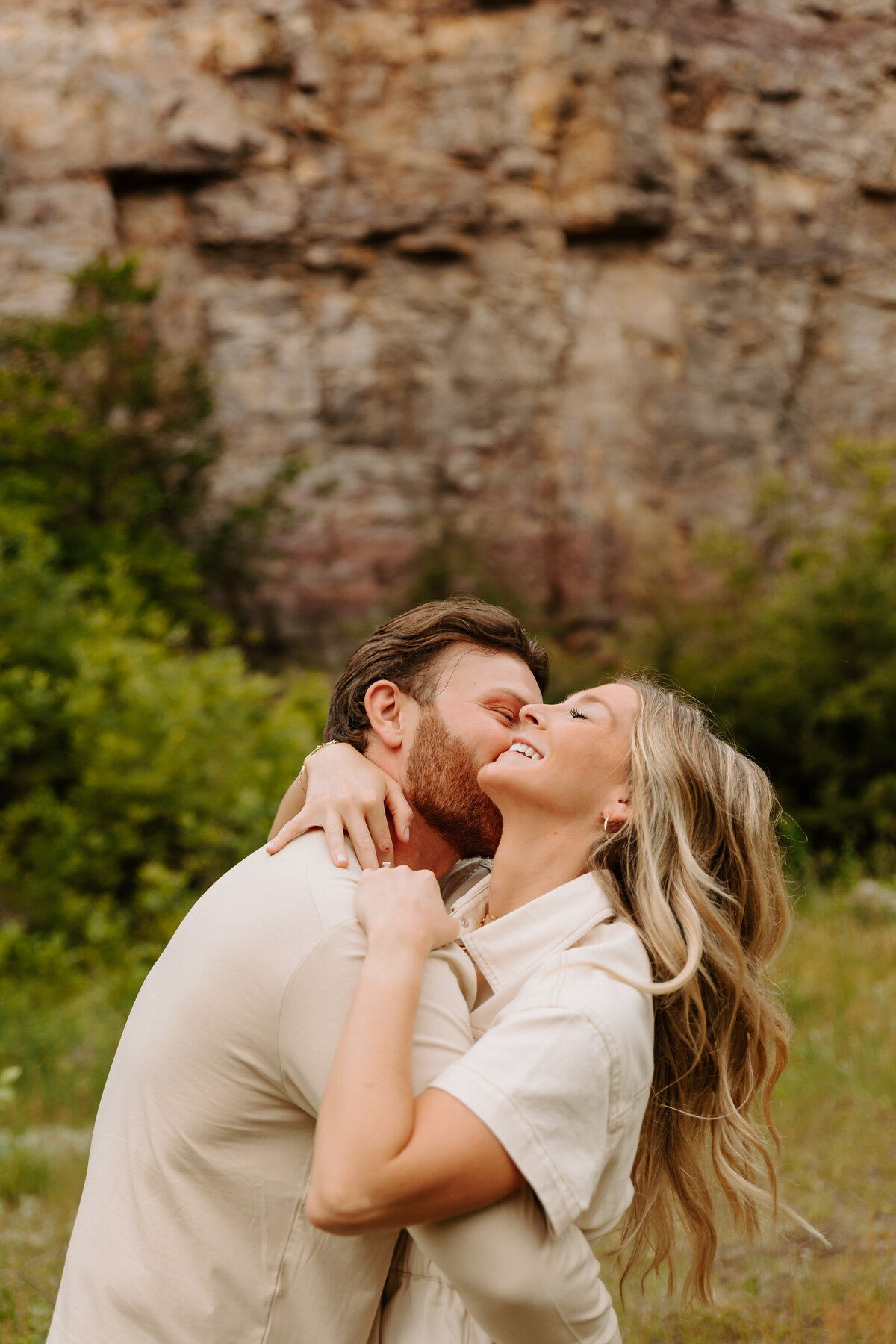 A person kissing their partner's cheek