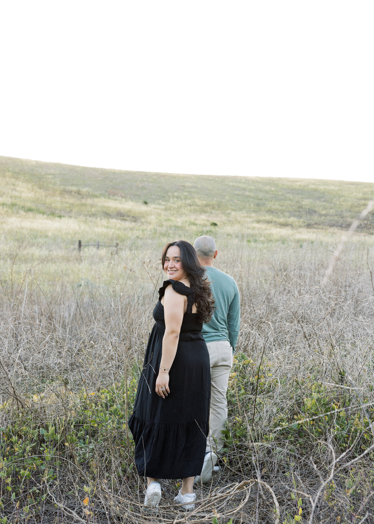 couple photo in flower field and rolling hills