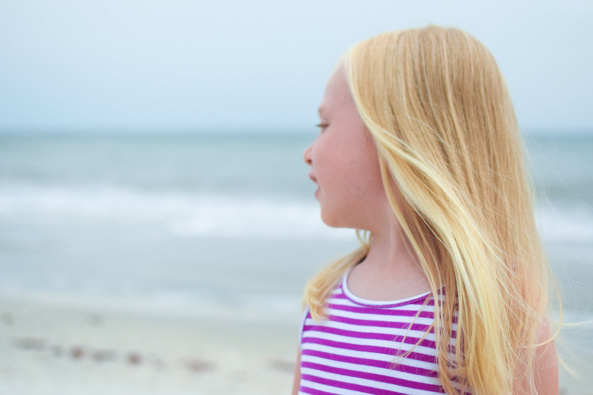 Blonde little girl beach Naples Florida