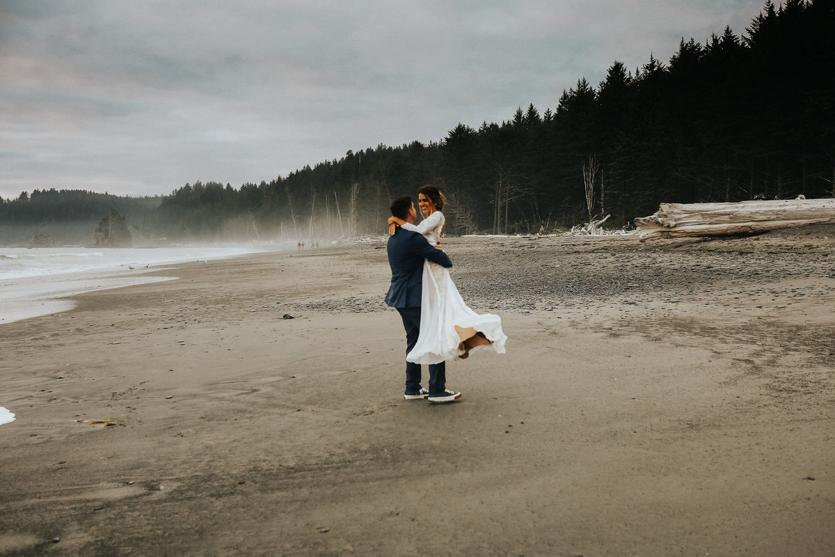 Bride and groom have their first dance during their elopement in Forks Washington at La Push beach.