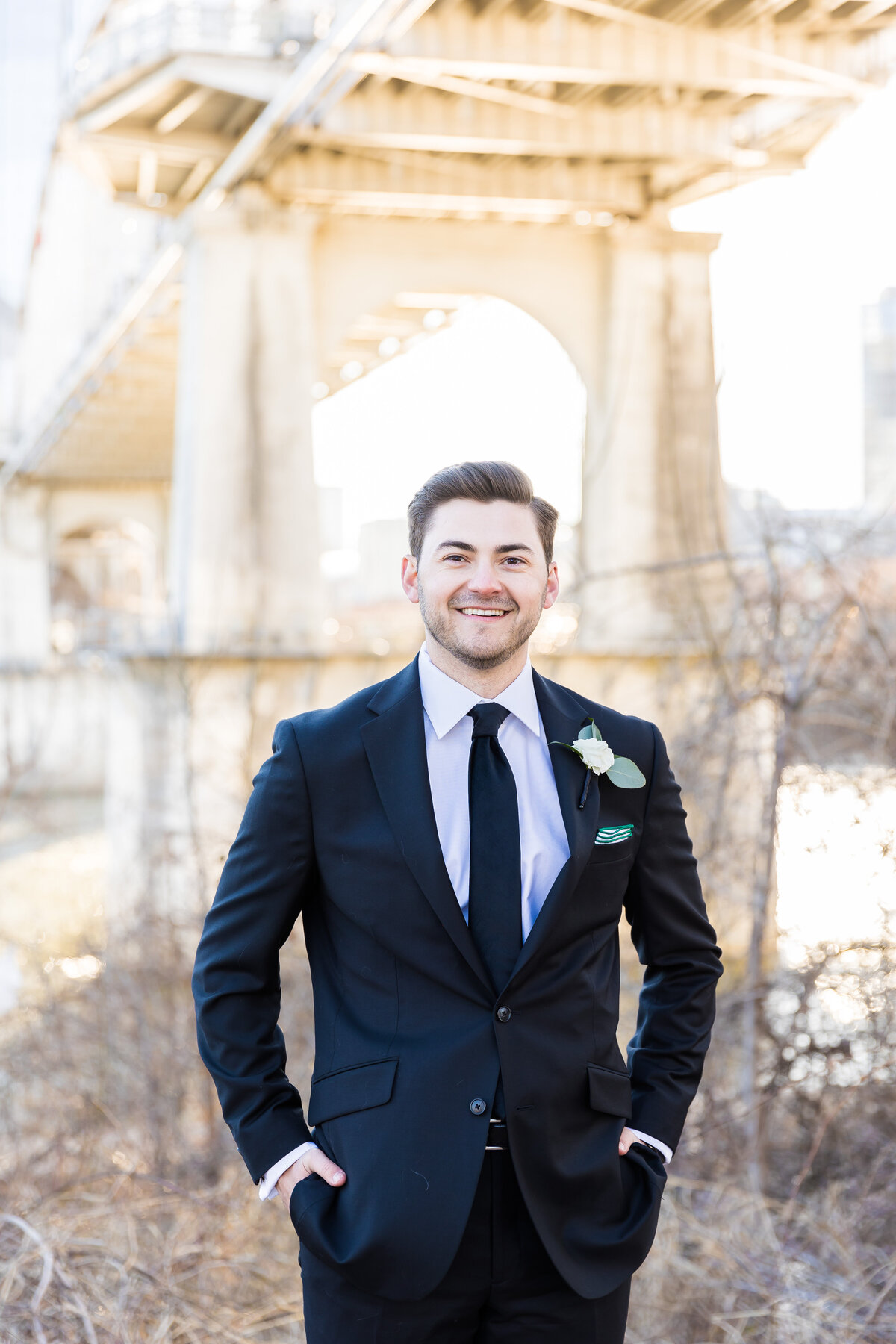Groom in a black suit at wedding at Tennessee State Museum