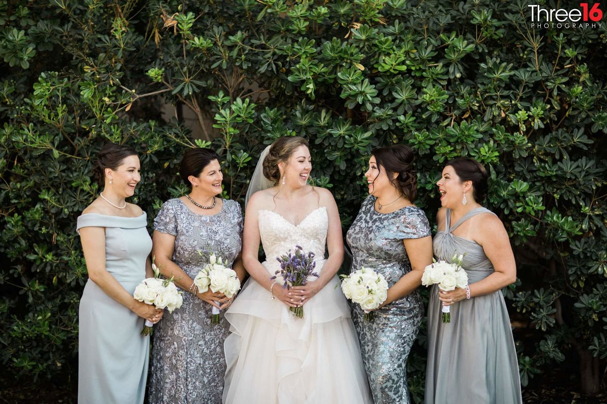 Bride and her Bridesmaids share a laugh together