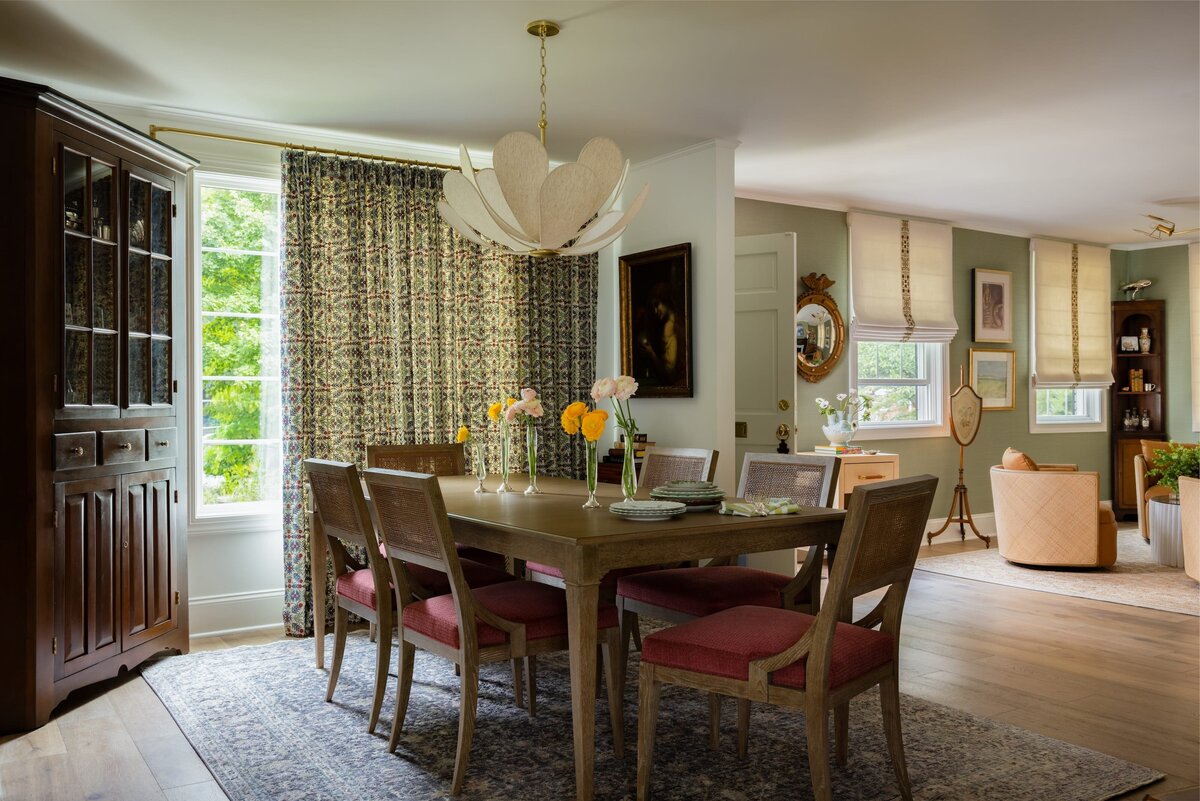 melinda chesson interiors poindexter dining room table with accent rug and patterned curtains