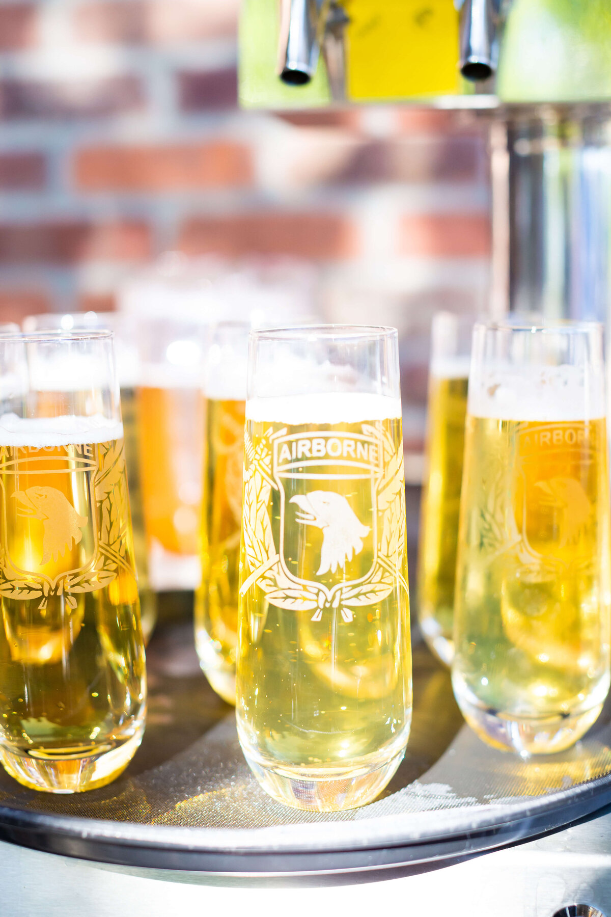Champagne in personalized glasses at Fat Bottom Brewery wedding reception in Nashville, TN
