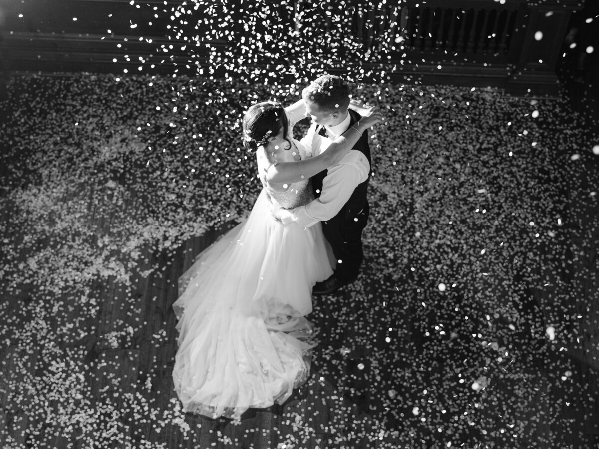 Bride and groom's first dance being showered with confetti