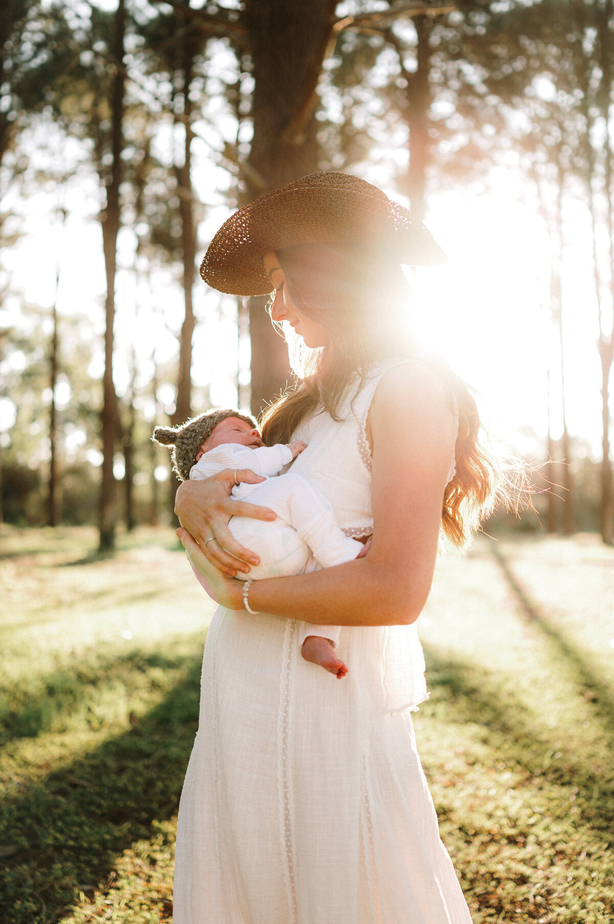New parent snuggling baby during photo session

