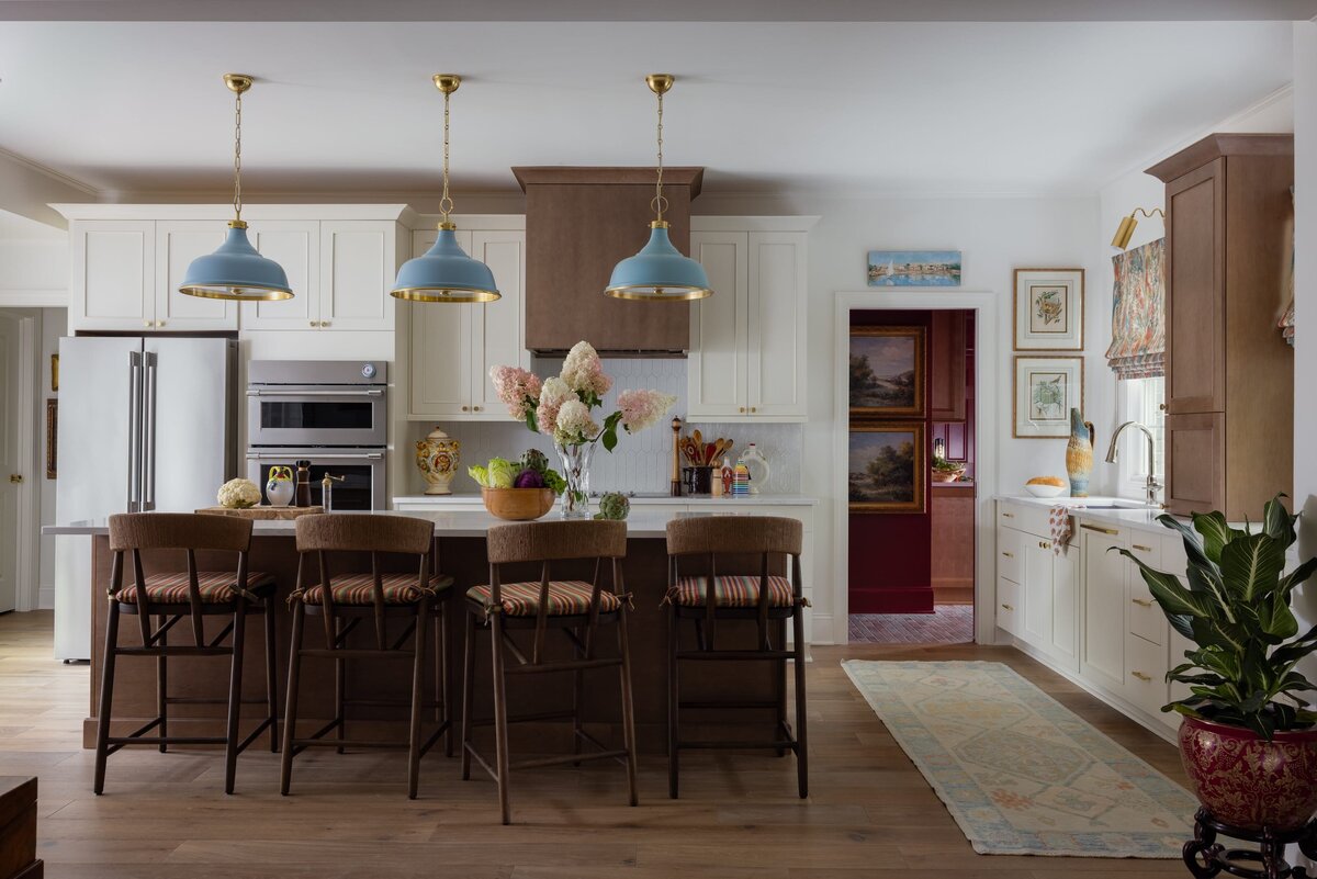 melinda chesson interiors poindexter  kitchen with large island and wooden barstools